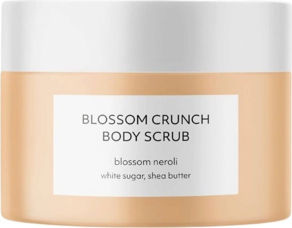 Estelle & Thild Blossom Crunch Body Scrub biologico da 200 ml per pelle idratata e levigata, con burro di karité e olio di jojoba, in un barattolo.